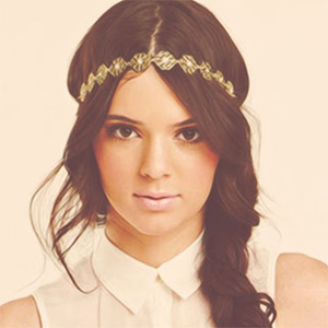 Bring out the warmth in brown hair with gold accessories