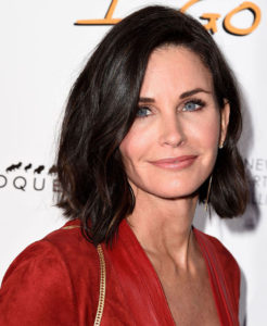 Brown tending hair with Courtney Cox and Renew